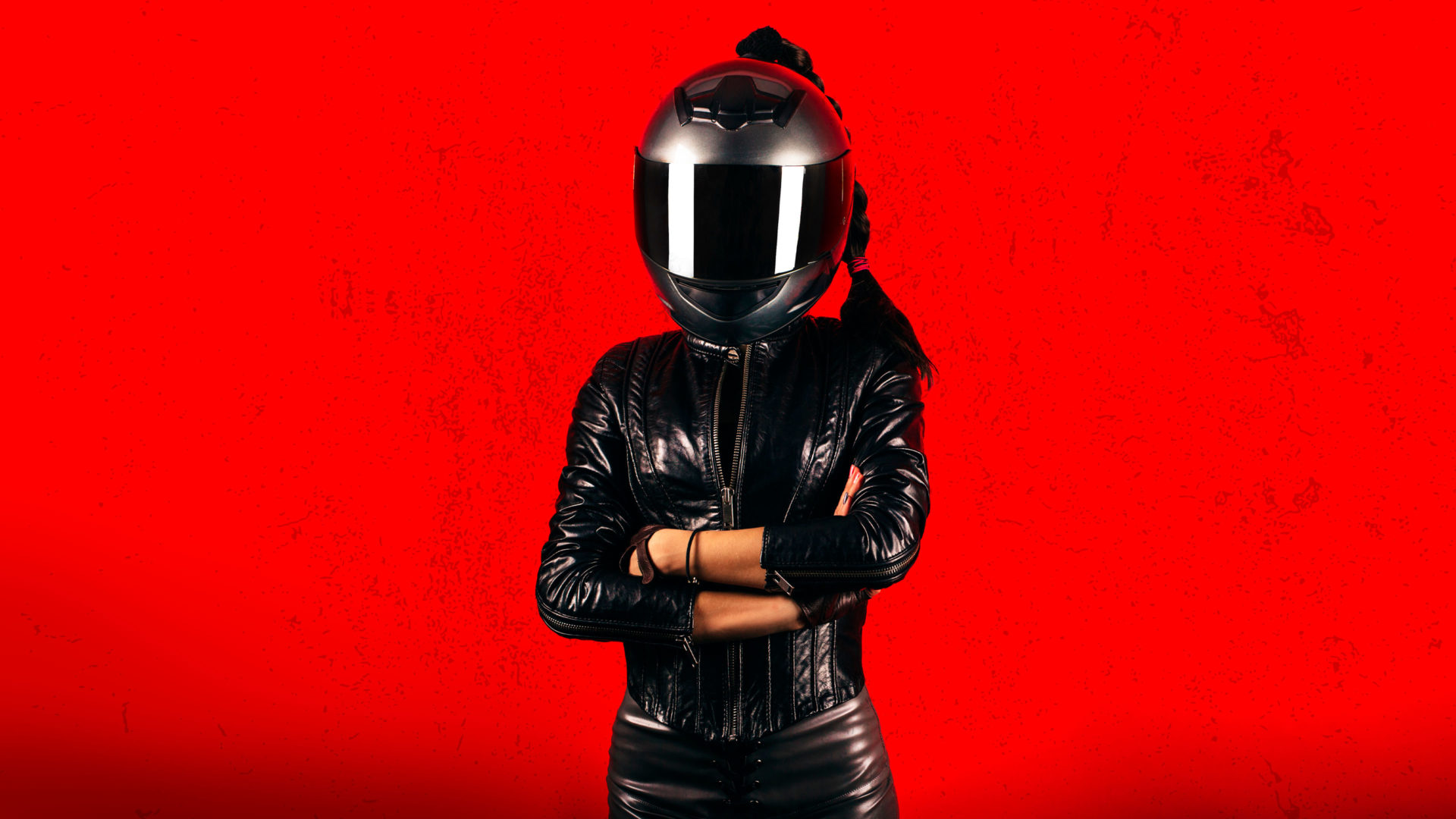 A film poster depicting a leather-clad woman biker standing with arms akimbo.